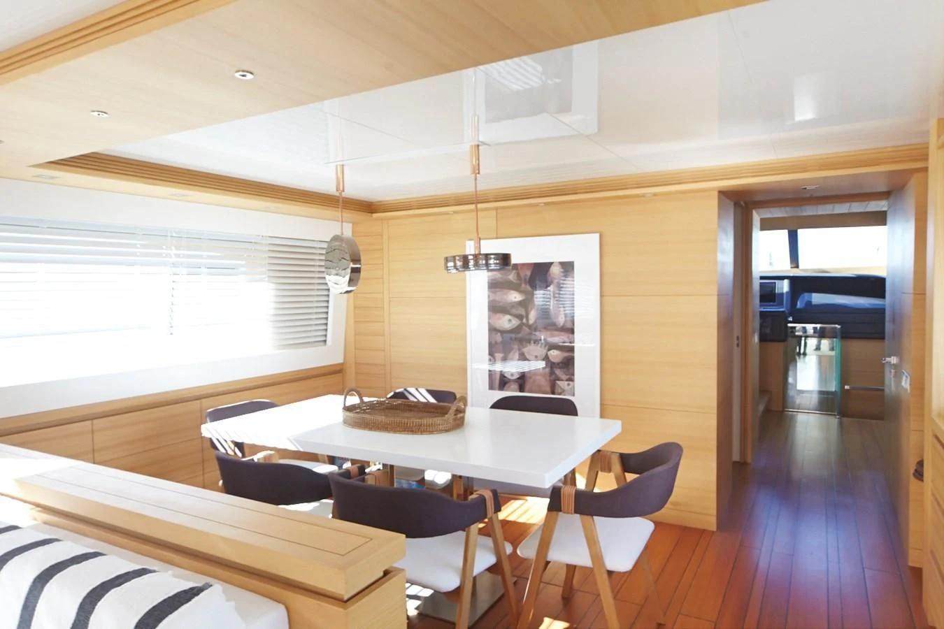 a room with a table and chairs aboard GULU Yacht for Sale