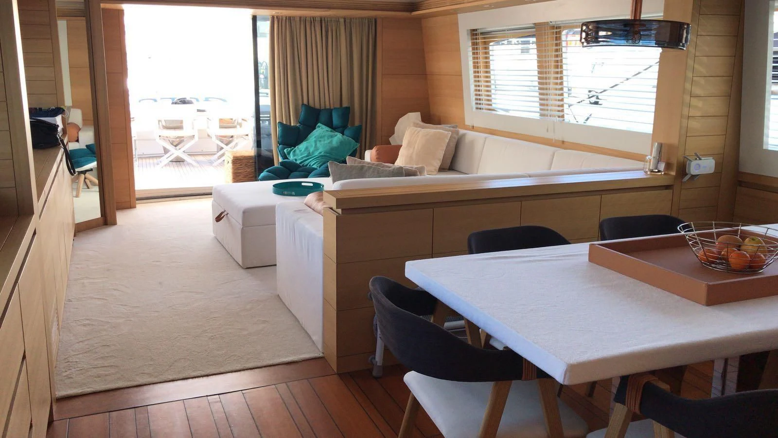 a room with a bed and a table aboard GULU Yacht for Sale