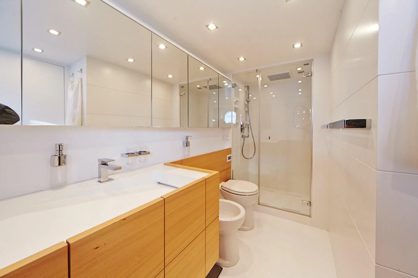 a bathroom with a large mirror aboard GULU Yacht for Sale