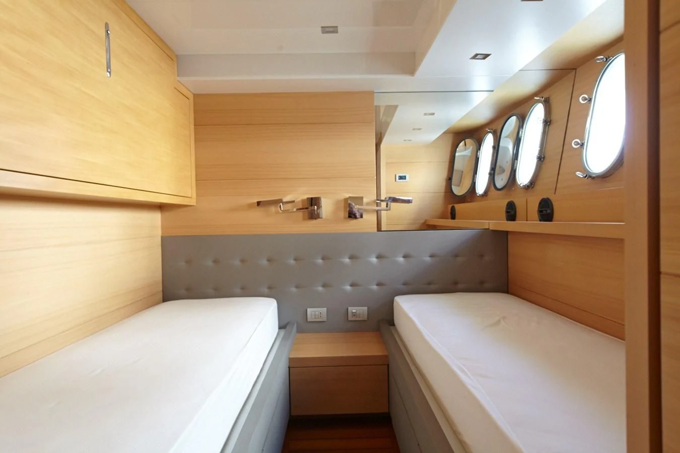 a room with a bed and a sink aboard GULU Yacht for Sale