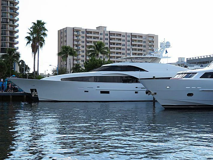 a yacht docked at a pier aboard ARIES Yacht for Sale