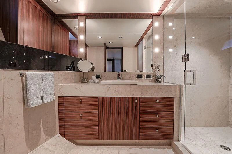 a bathroom with a large mirror aboard ARIES Yacht for Sale