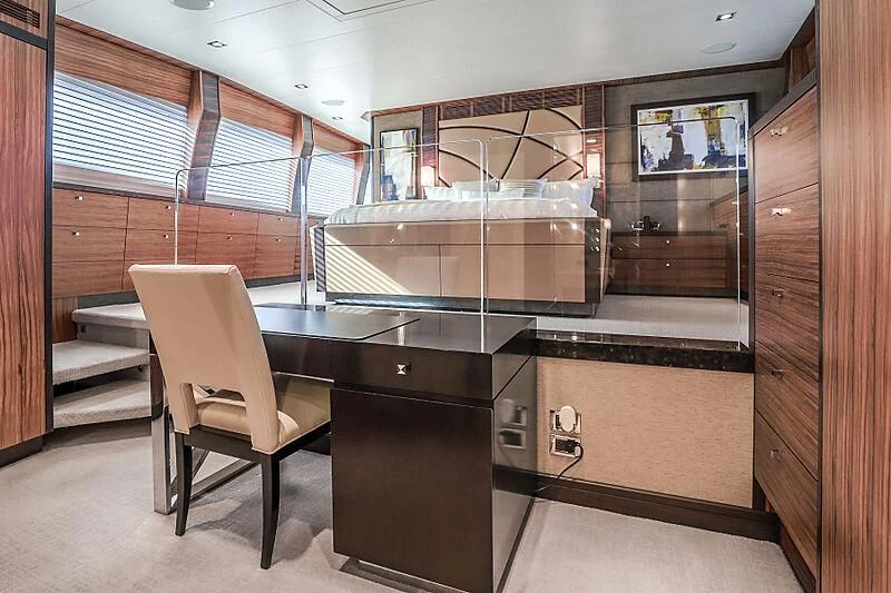 a room with a chair and a table and a bench aboard ARIES Yacht for Sale