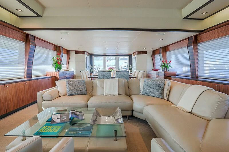 a living room with couches and a coffee table aboard ARIES Yacht for Sale