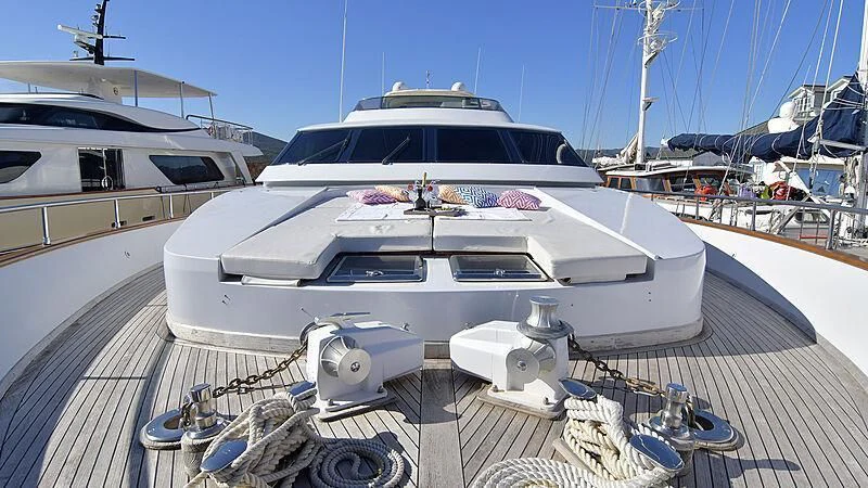 a white yacht on a deck aboard PIERPAOLO IV Yacht for Sale