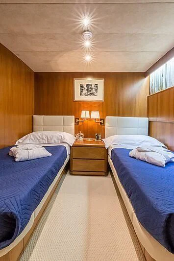a room with two beds aboard PIERPAOLO IV Yacht for Sale