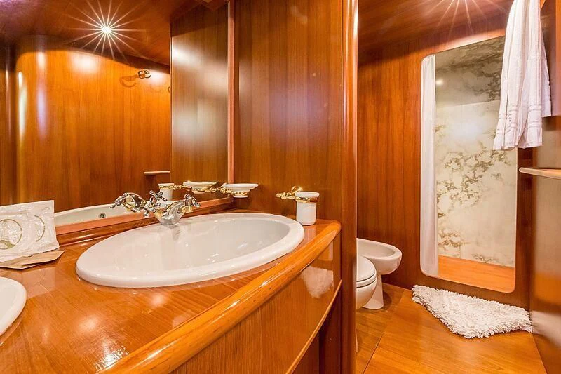a bathroom with a sink and a toilet aboard PIERPAOLO IV Yacht for Sale