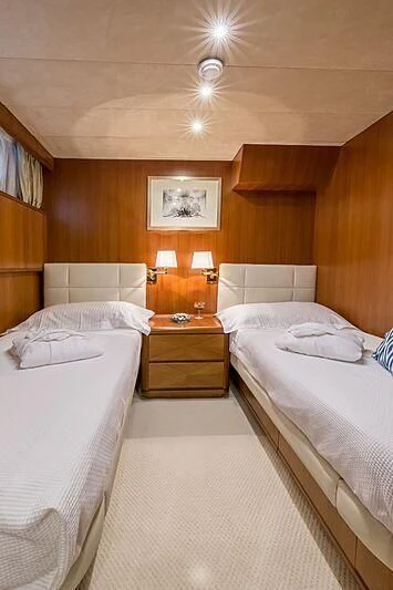 a room with two beds aboard PIERPAOLO IV Yacht for Sale