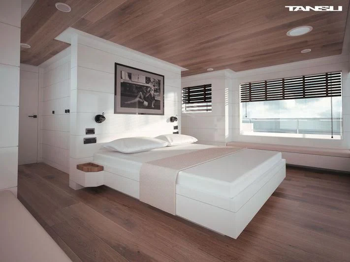 a room with a bed and a window aboard GREY Yacht for Sale