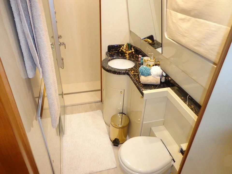 a bathroom with a sink and toilet aboard MARACANA Yacht for Sale