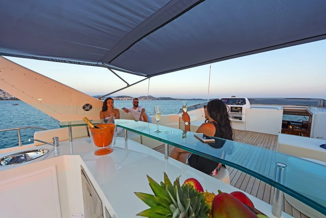 a group of people sitting at a table on a boat aboard MARACANA Yacht for Sale