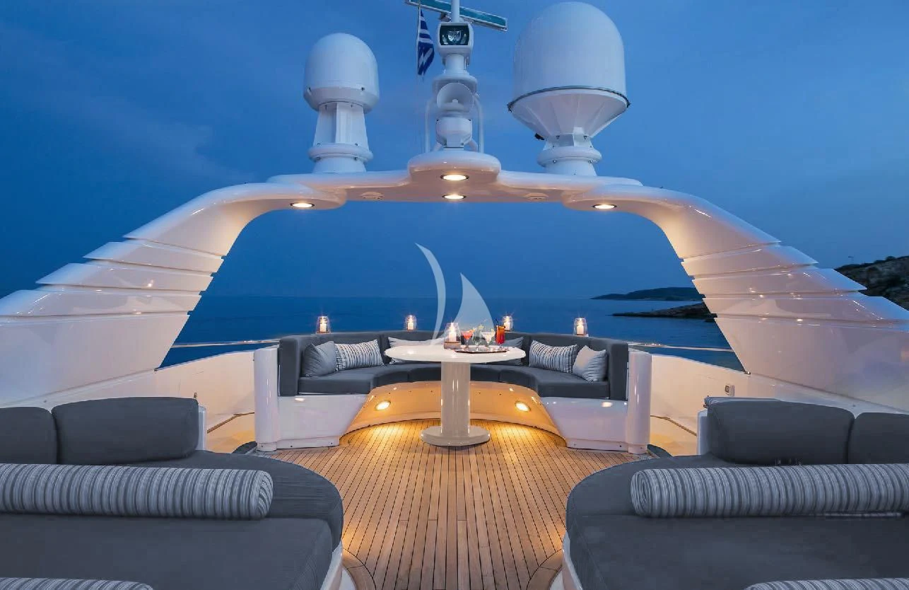 a room with a large white table and chairs and a large white lamp aboard JAAN Yacht for Sale