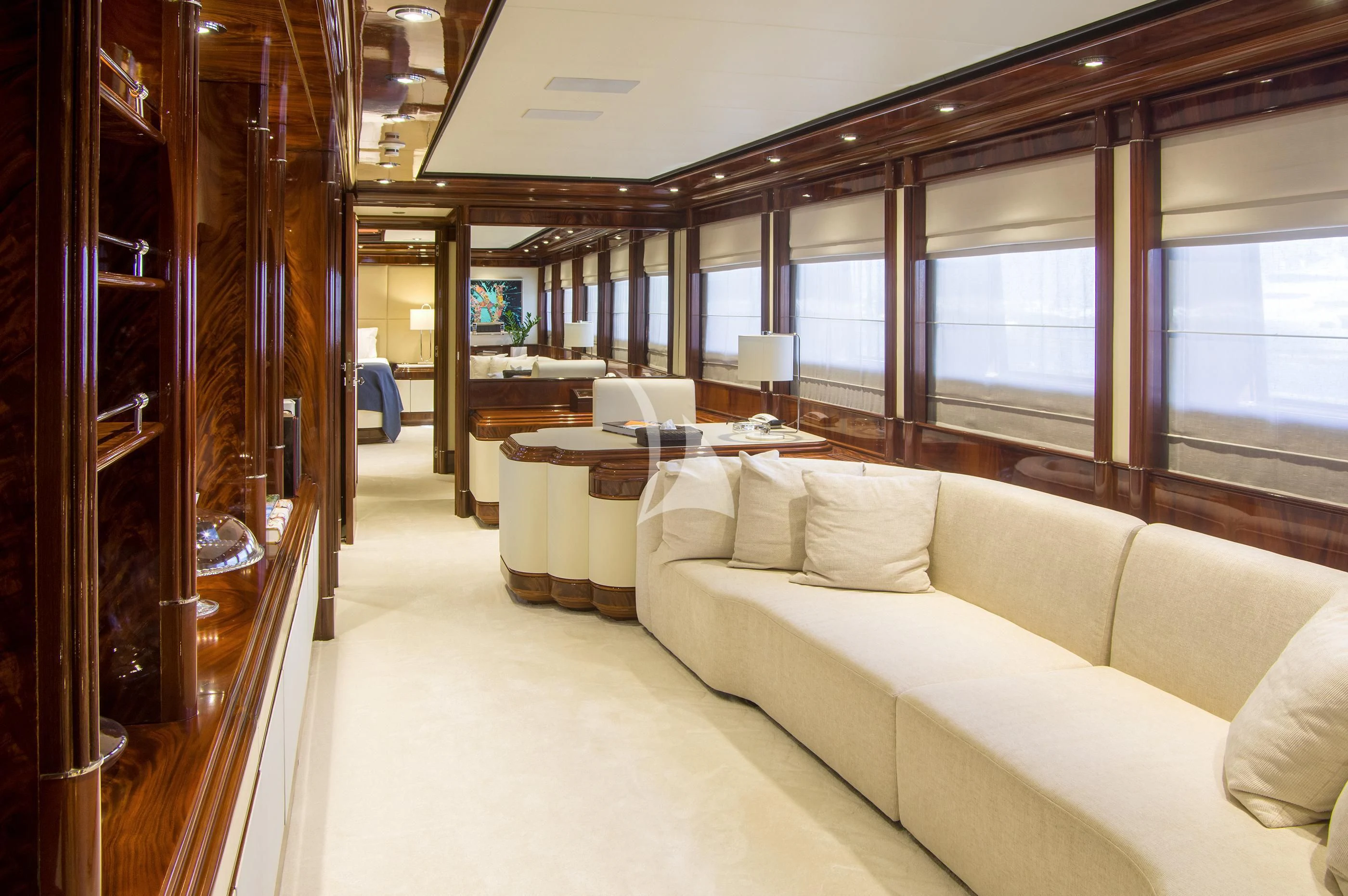 a room with a couch and a table aboard JAAN Yacht for Sale