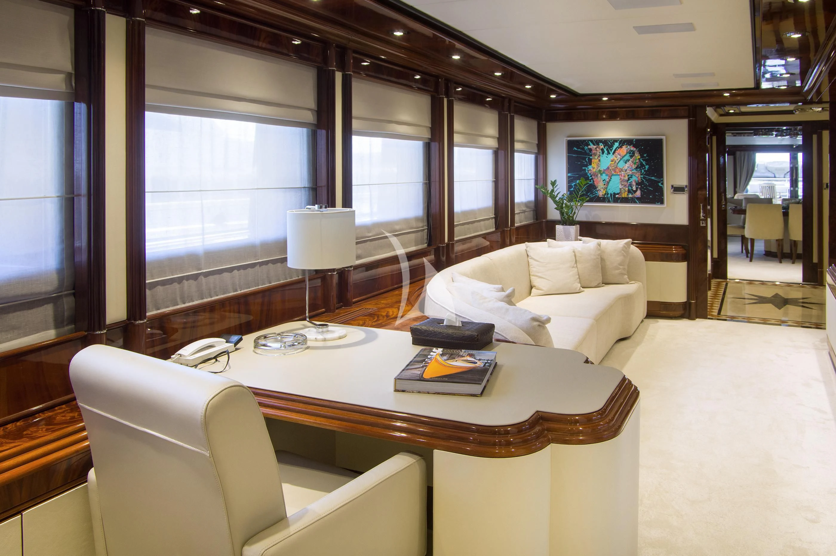 a living room with a couch and a table aboard JAAN Yacht for Sale