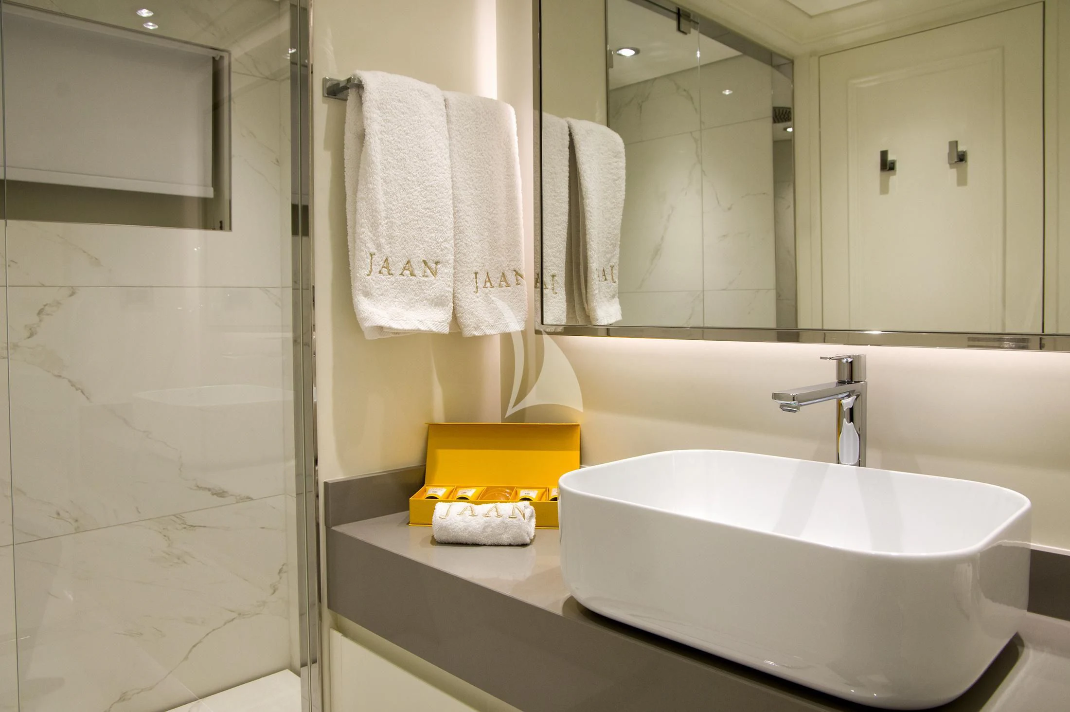 a bathroom with a sink and towels aboard JAAN Yacht for Sale