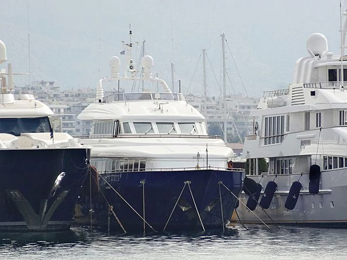 several boats docked in a harbor aboard JAAN Yacht for Sale