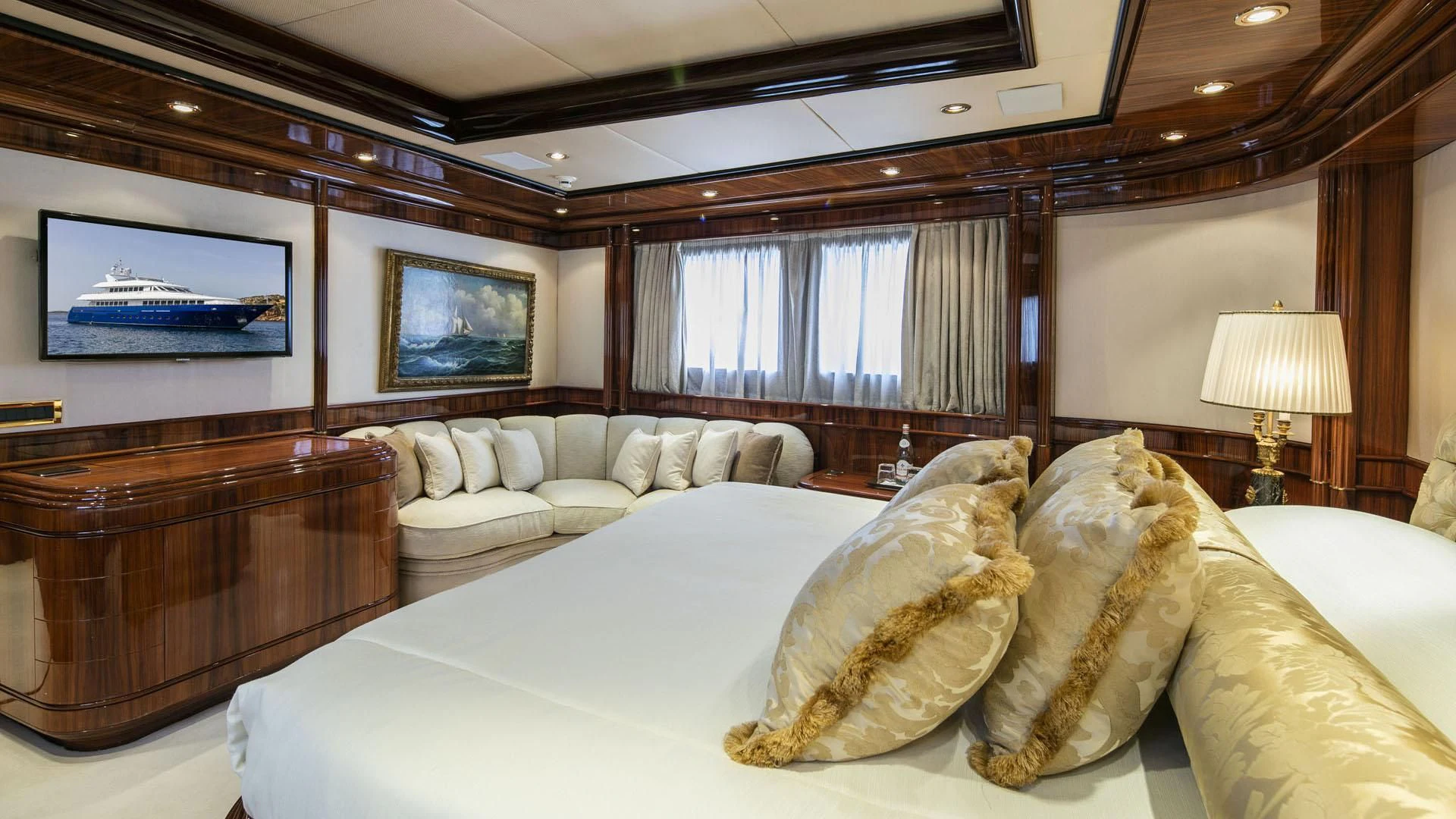a large bed in a hotel room aboard JAAN Yacht for Sale