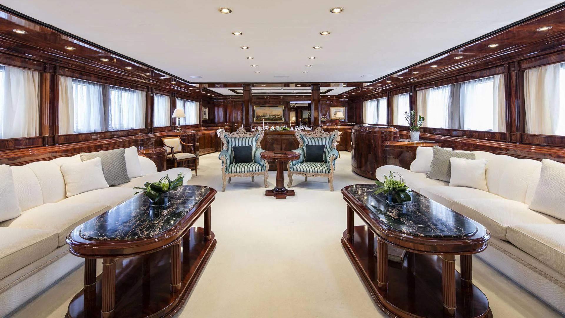a living room with a couch and a table aboard JAAN Yacht for Sale
