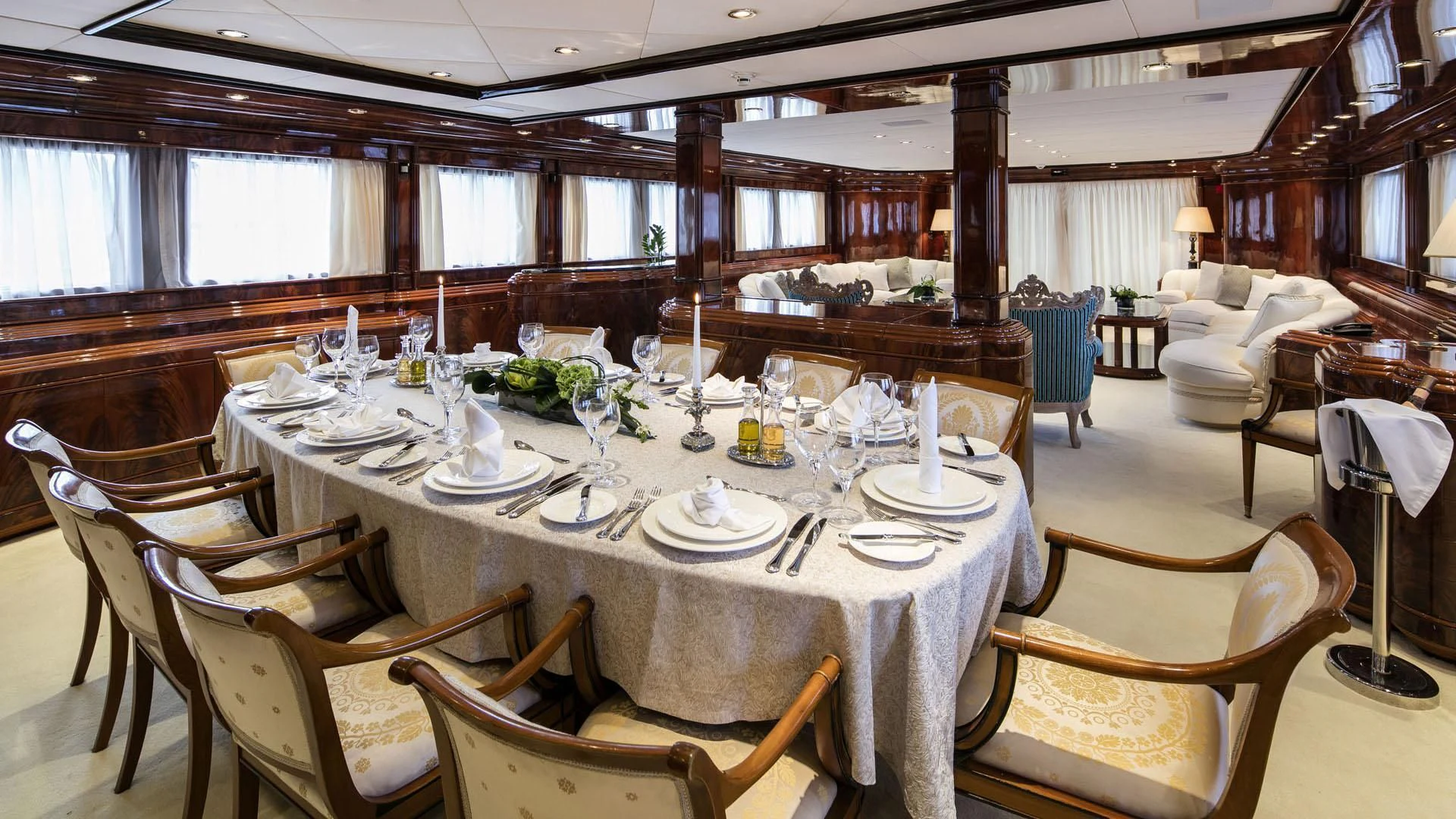 a dining room with a table set aboard JAAN Yacht for Sale