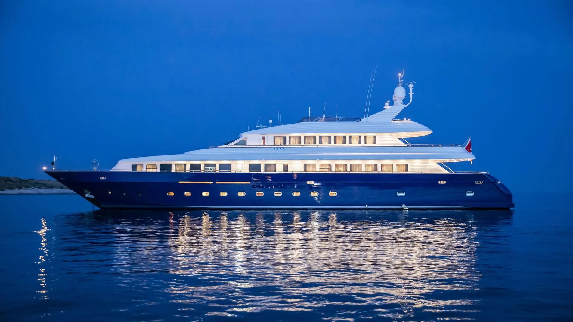 a large cruise ship in the water aboard JAAN Yacht for Sale