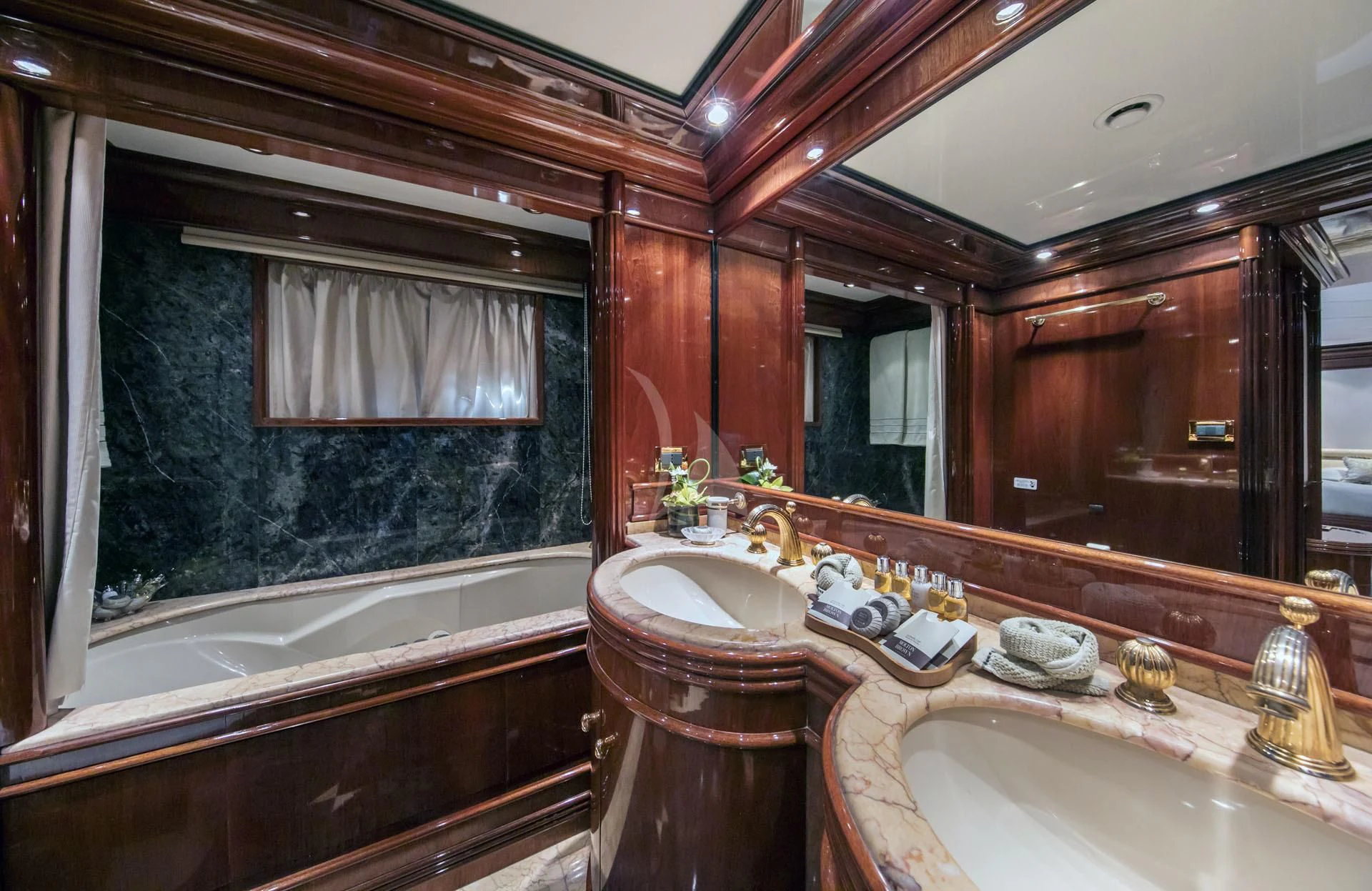 a bathroom with a large mirror aboard JAAN Yacht for Sale