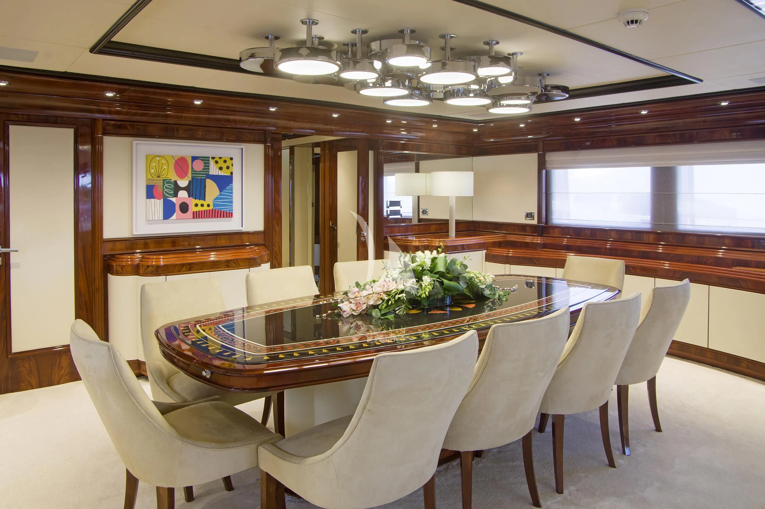 a large room with a table and chairs aboard JAAN Yacht for Sale