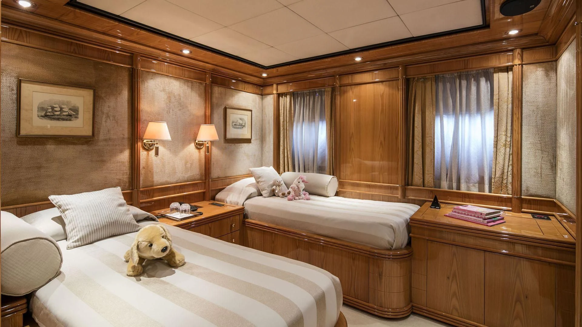 a room with a couple beds aboard JAAN Yacht for Sale