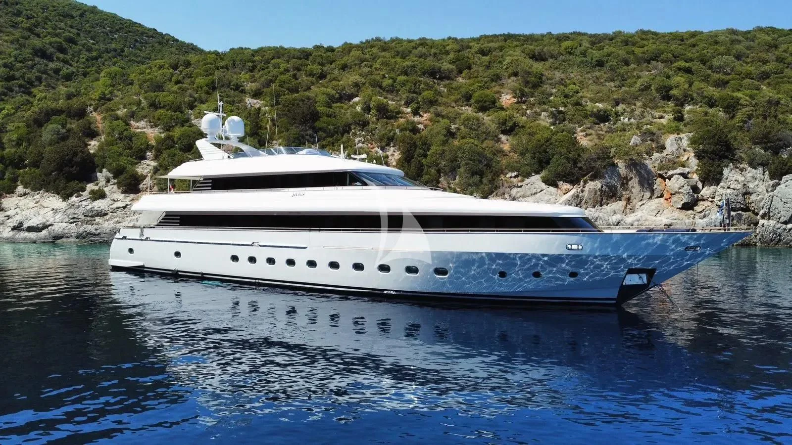 a white yacht on the water aboard JAAN Yacht for Sale