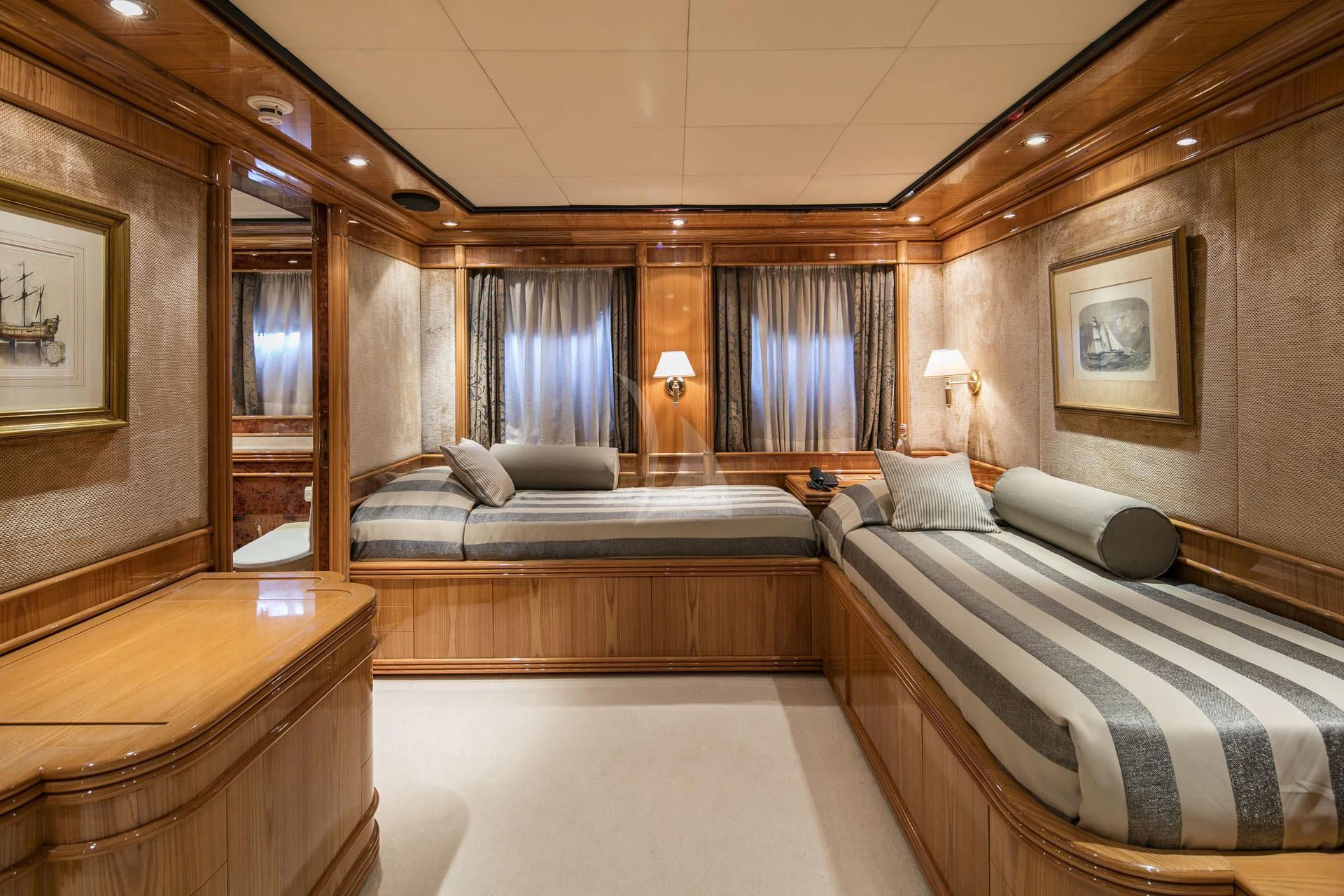 a room with a bed and a couch aboard JAAN Yacht for Sale