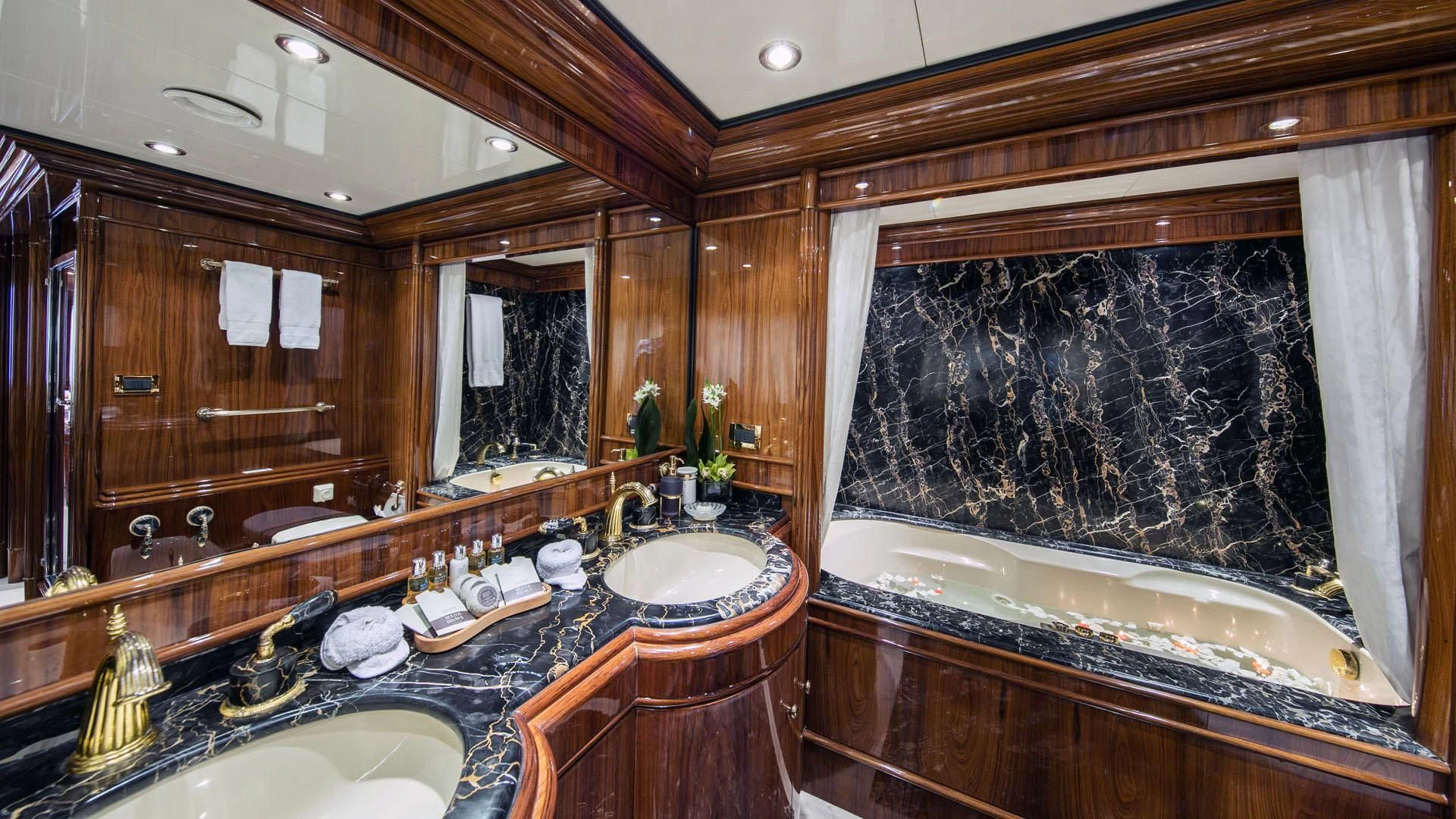 a bathroom with a large mirror aboard JAAN Yacht for Sale