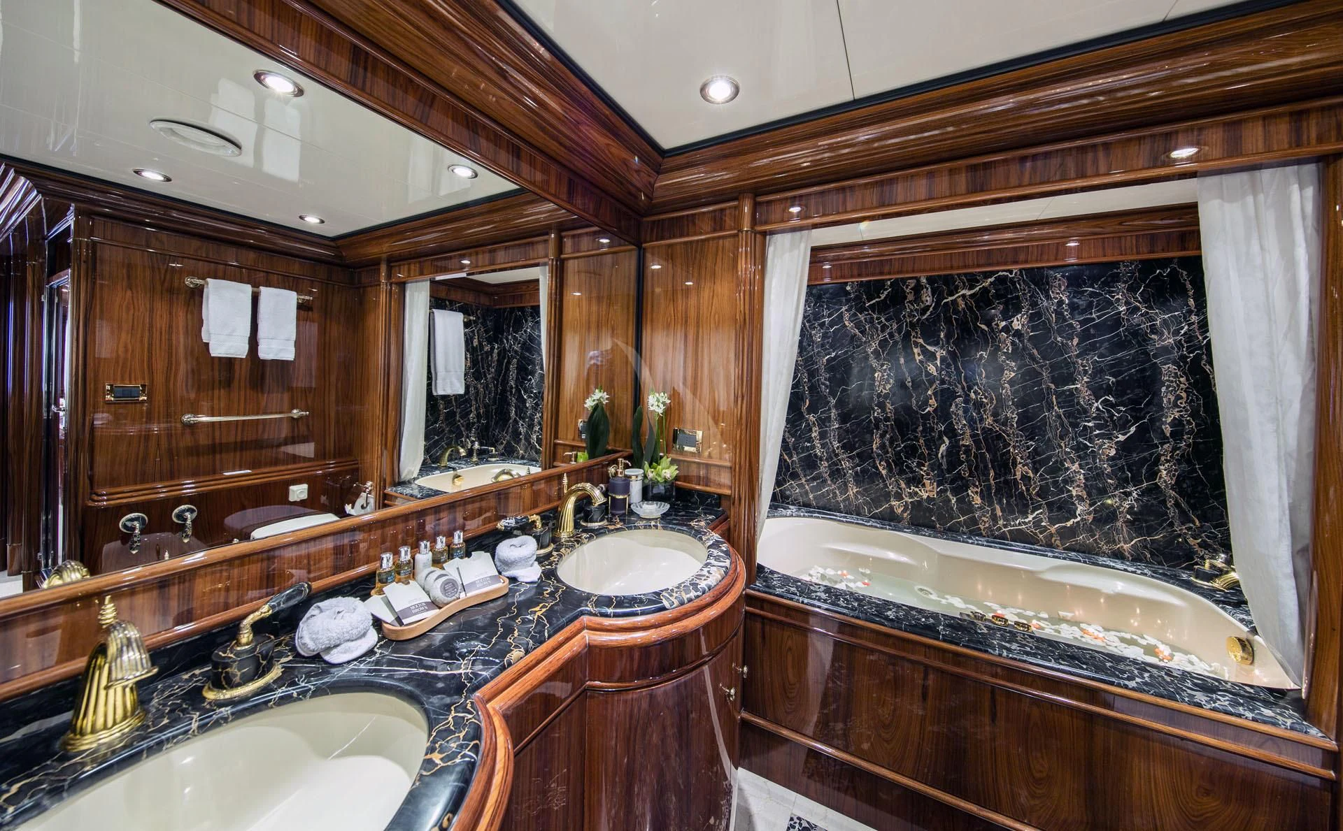 a bathroom with a large mirror aboard JAAN Yacht for Sale