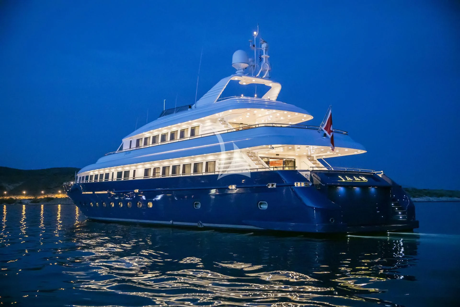 a large cruise ship in the water aboard JAAN Yacht for Sale