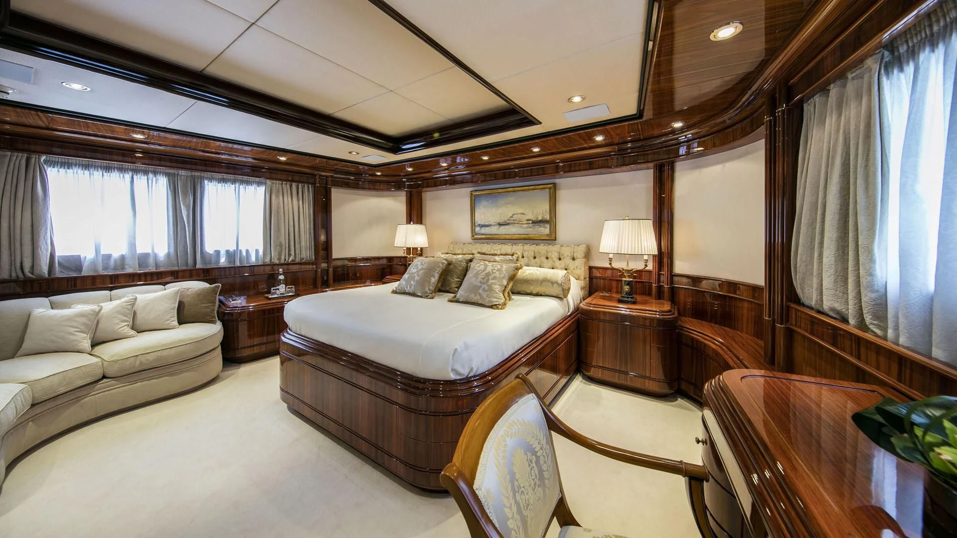 a large bedroom with a bed and a couch aboard JAAN Yacht for Sale