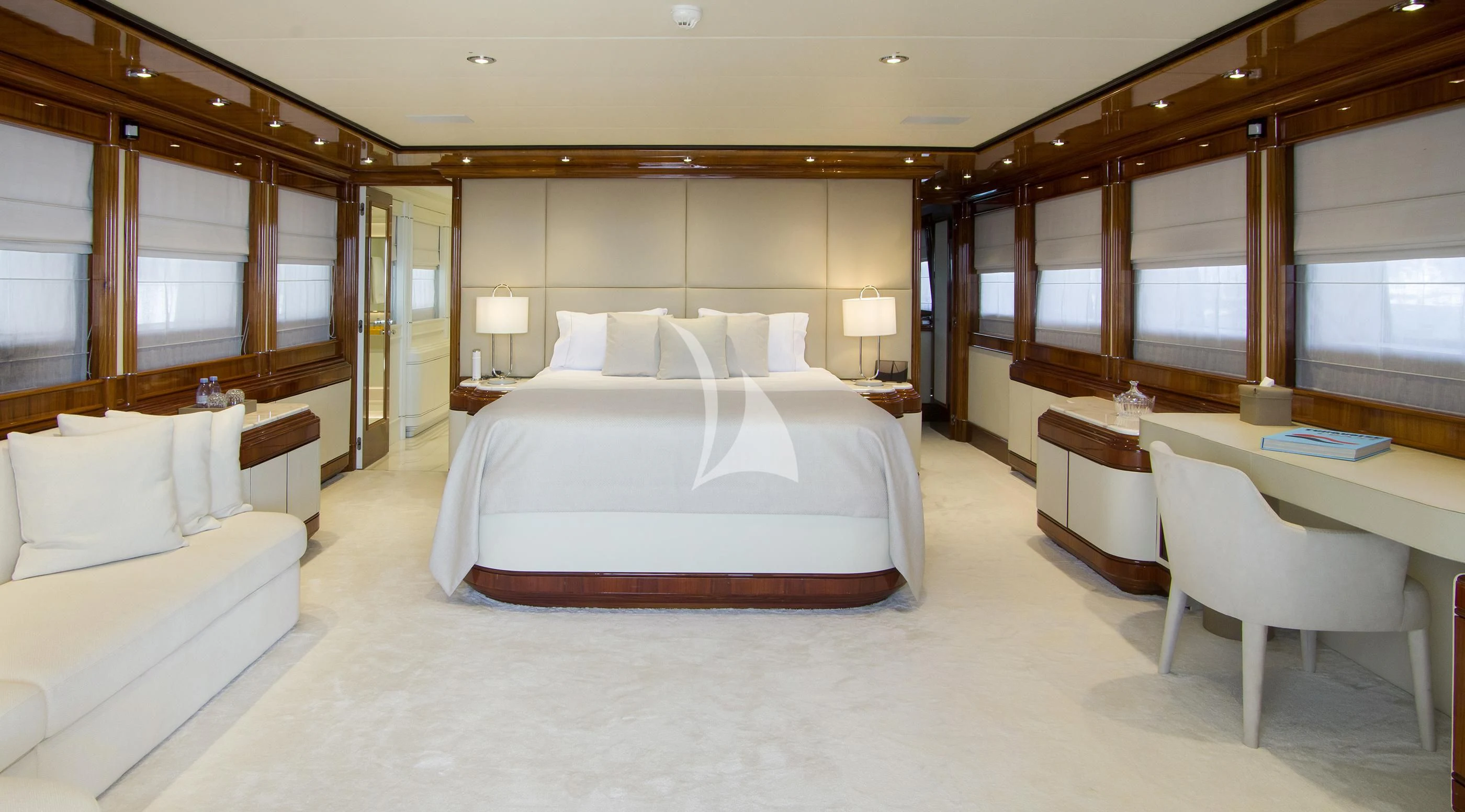 a large room with a bed and a desk aboard JAAN Yacht for Sale