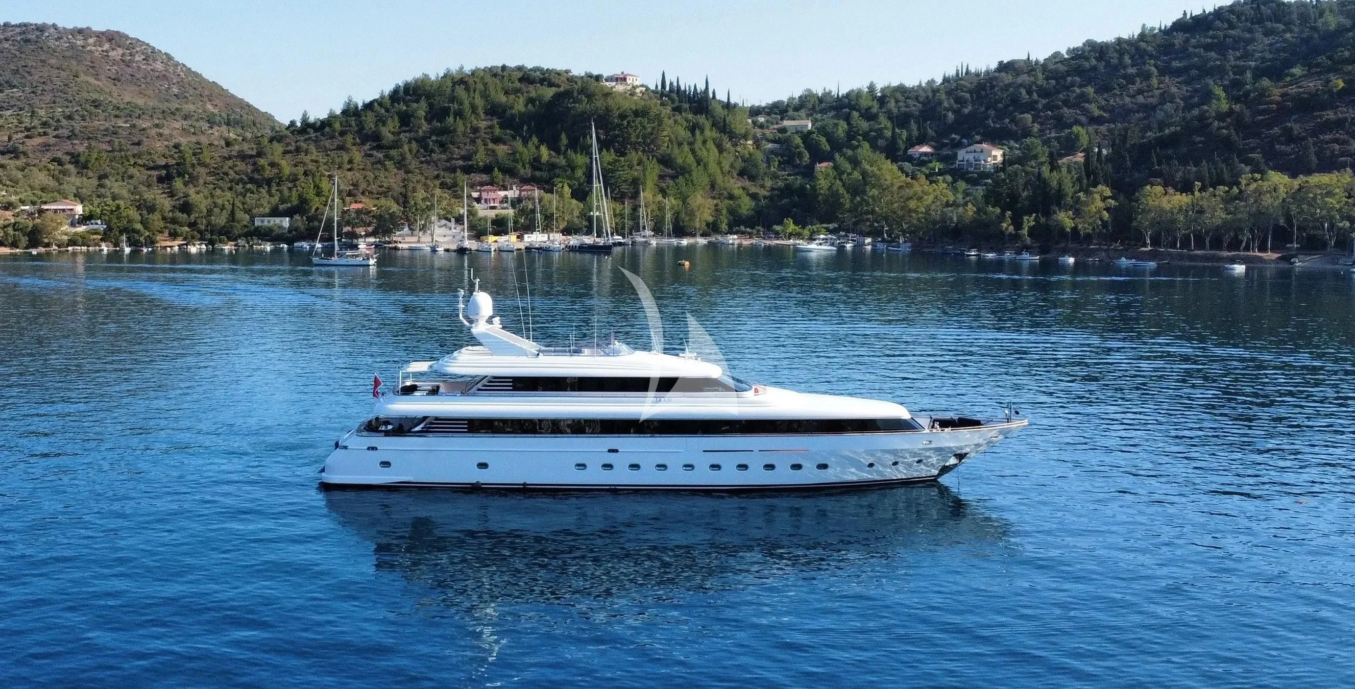 a white boat in the water aboard JAAN Yacht for Sale