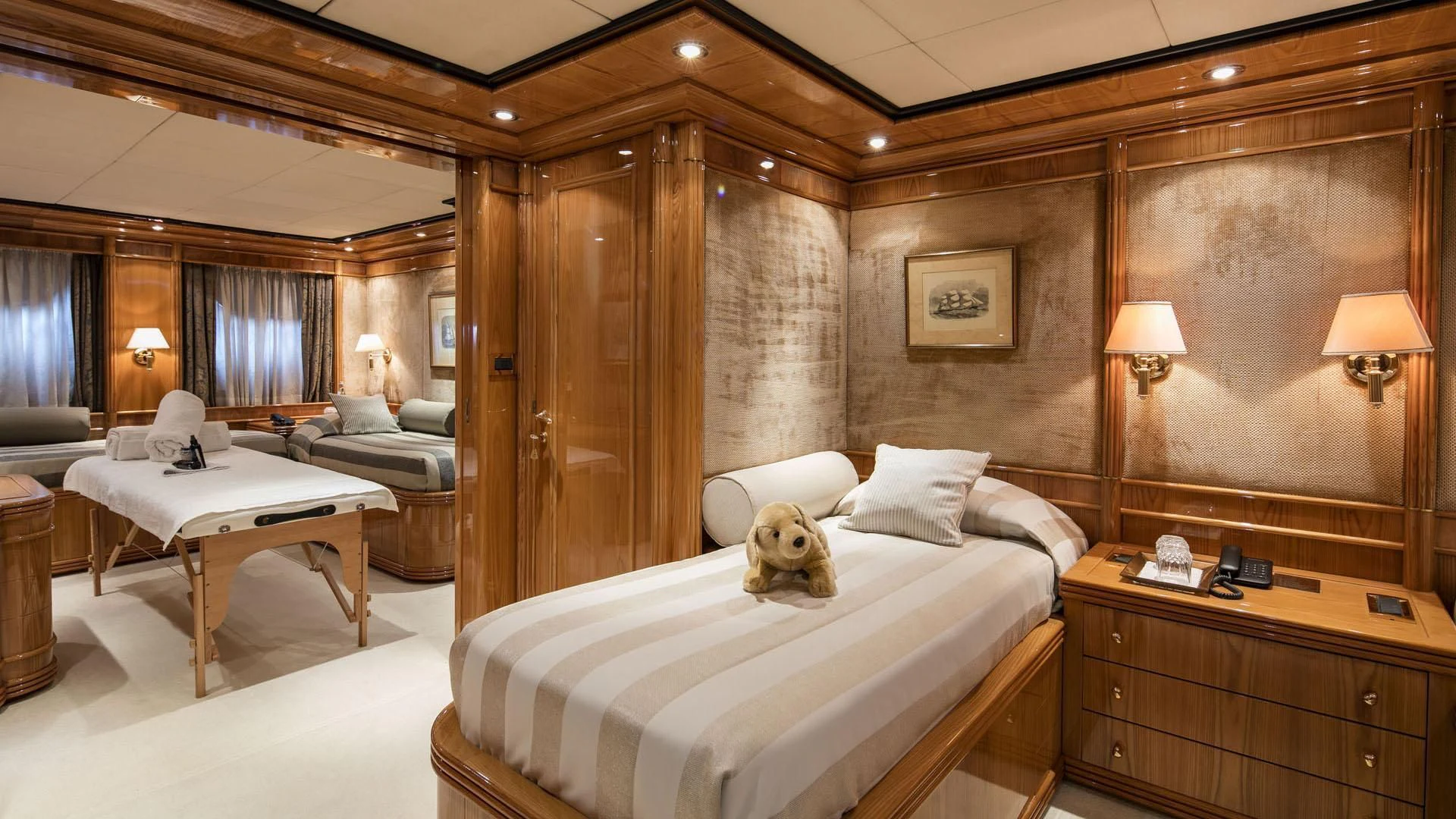 a dog sitting on a bed aboard JAAN Yacht for Sale