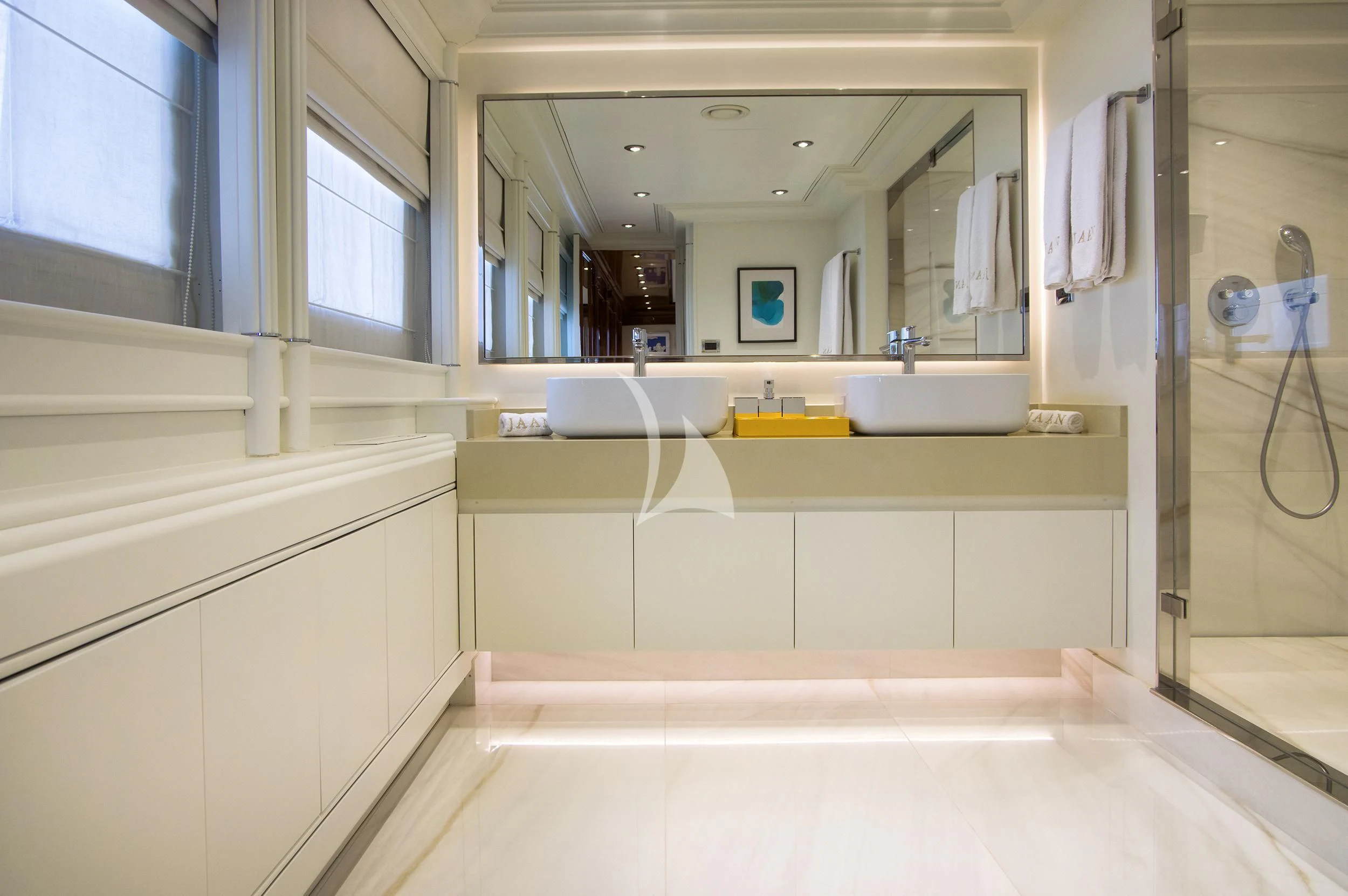 a bathroom with a large mirror aboard JAAN Yacht for Sale