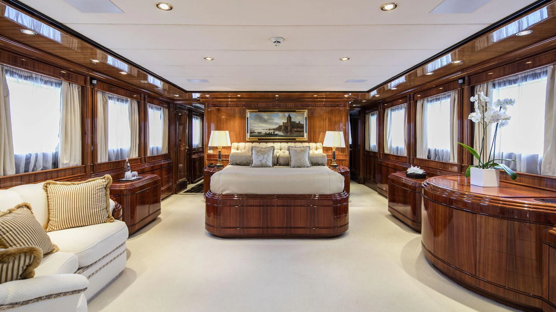 a large bedroom with a large mirror aboard JAAN Yacht for Sale