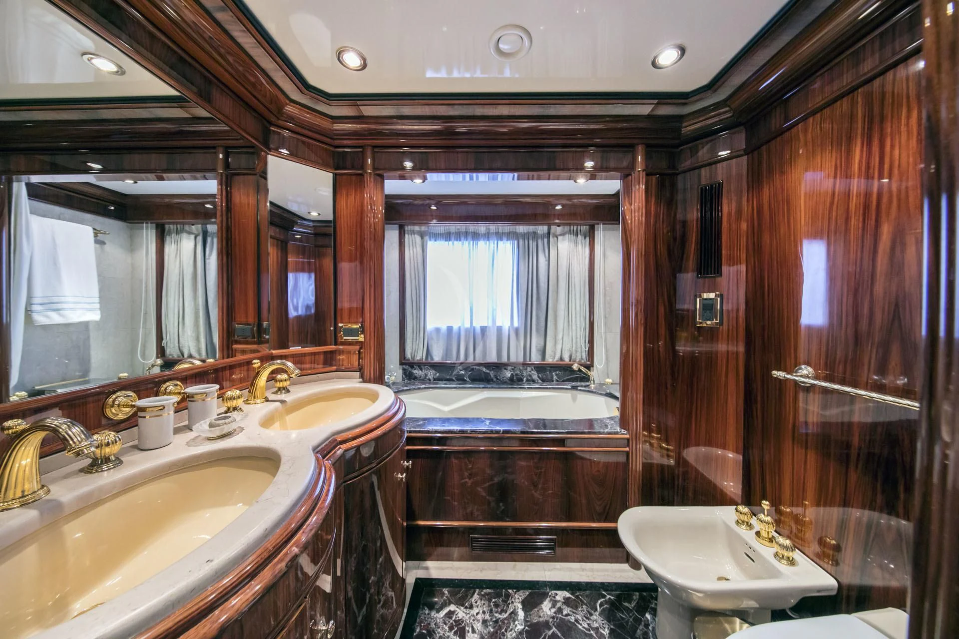 a bathroom with a large mirror aboard JAAN Yacht for Sale