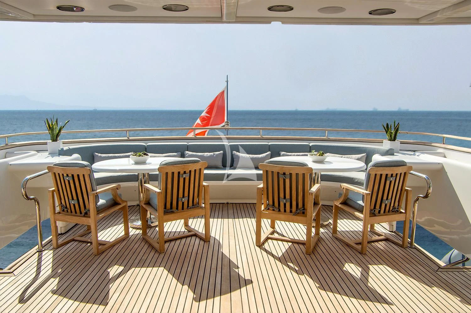 a deck with chairs and tables on it aboard JAAN Yacht for Sale
