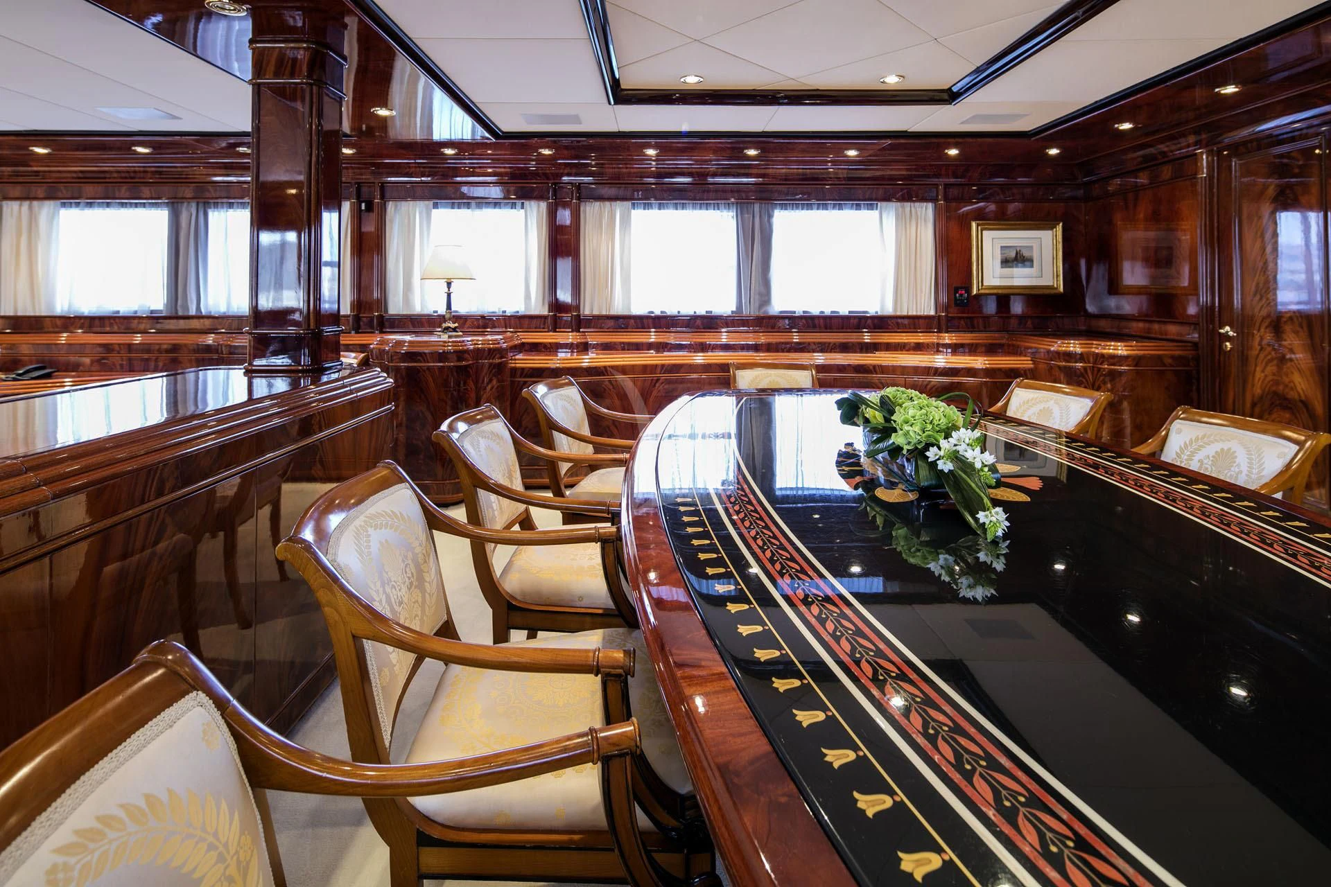 a large room with a piano aboard JAAN Yacht for Sale