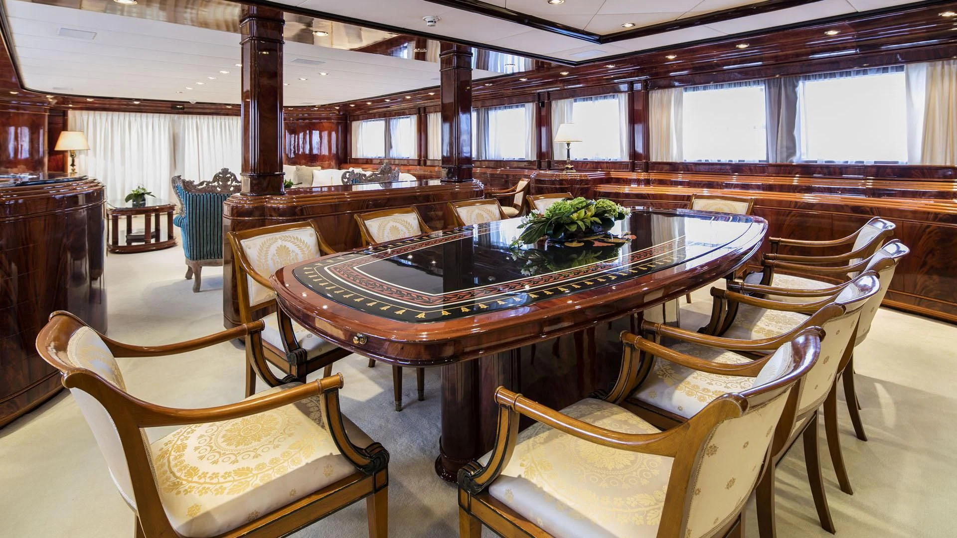 a large room with a table and chairs aboard JAAN Yacht for Sale