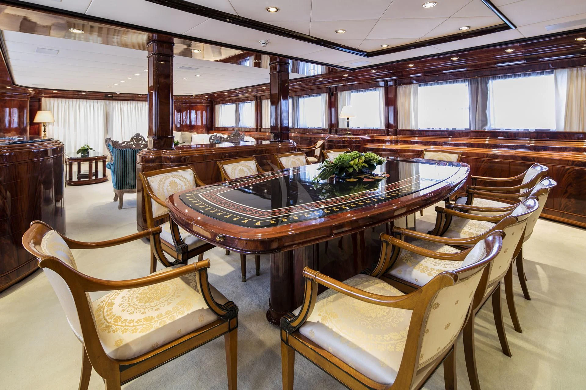 a large dining table in a room aboard JAAN Yacht for Sale