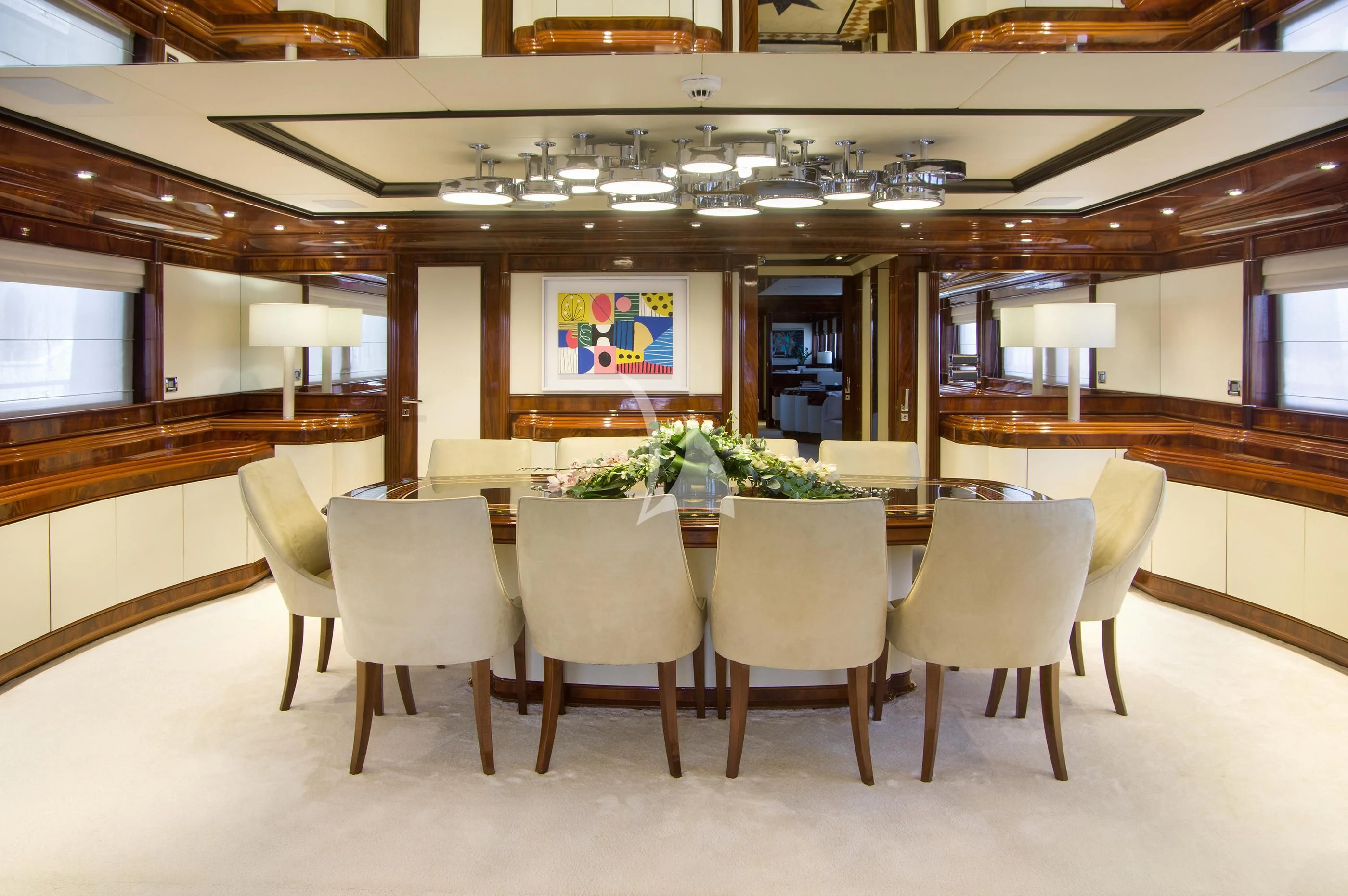 a room with a table and chairs aboard JAAN Yacht for Sale