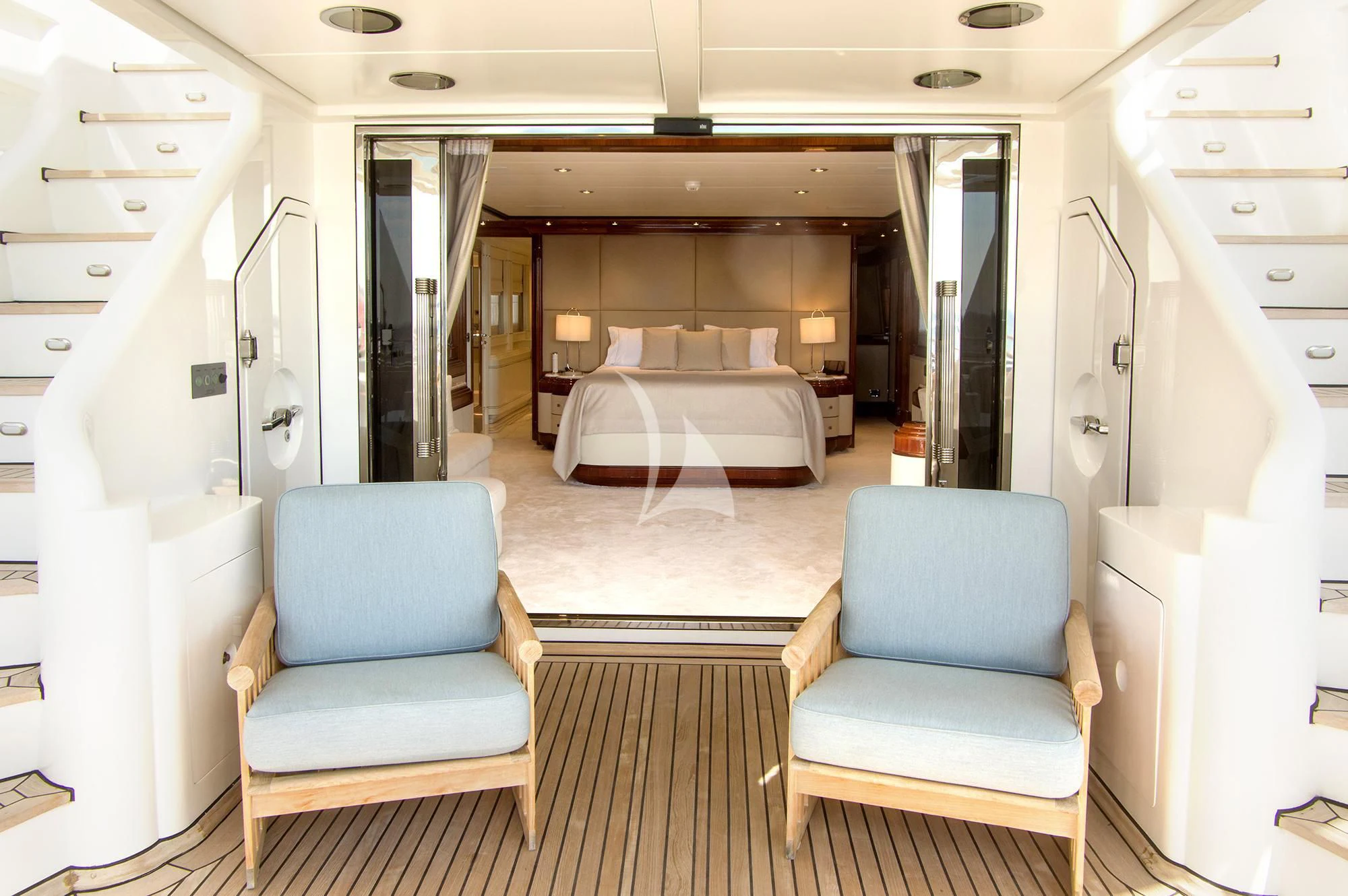 a room with a bed and a chair aboard JAAN Yacht for Sale