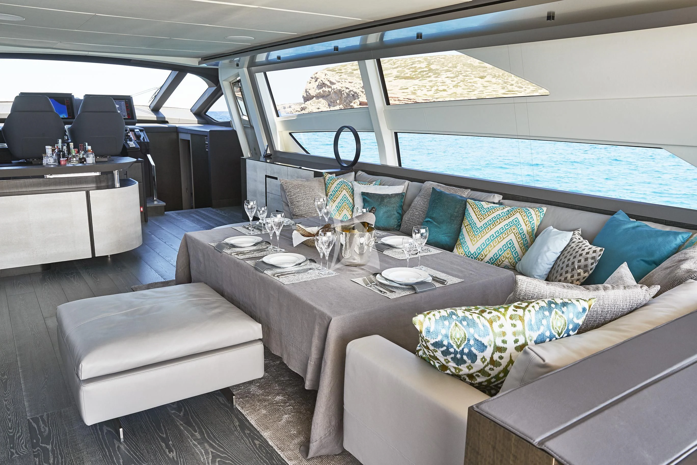 a boat with a table and chairs aboard BALOO III Yacht for Sale