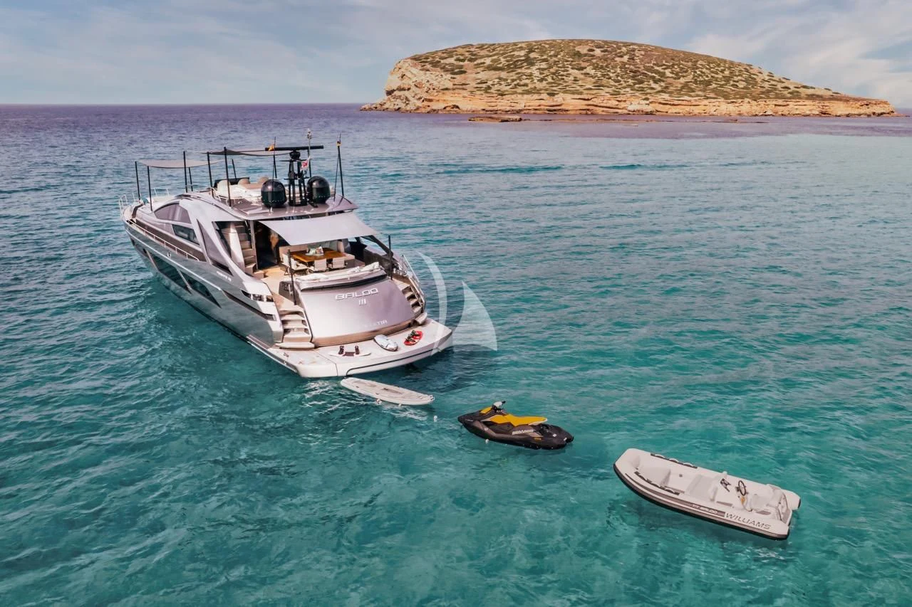 a boat and a couple of boats in the water aboard BALOO III Yacht for Sale