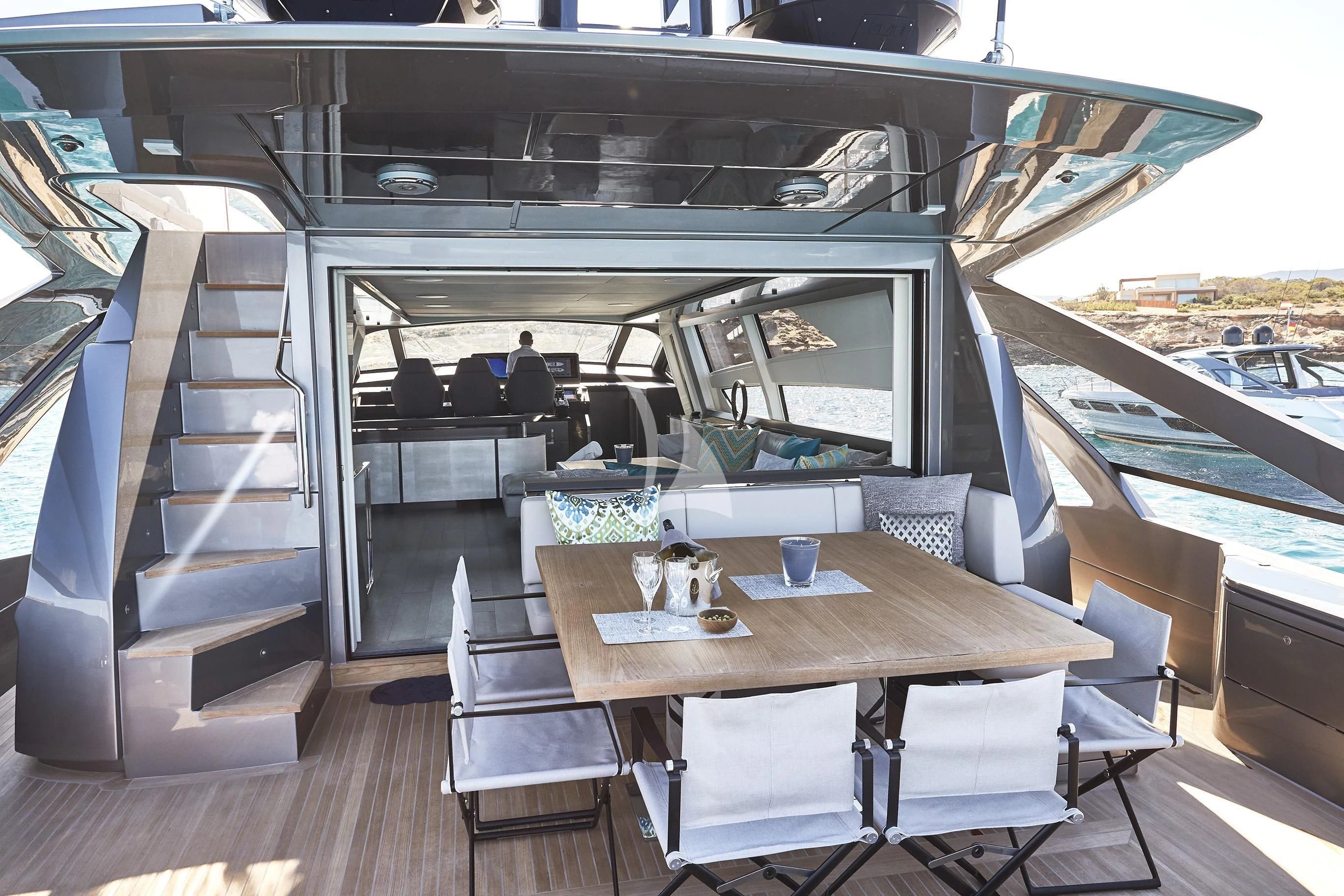 a room with a table and chairs aboard BALOO III Yacht for Sale