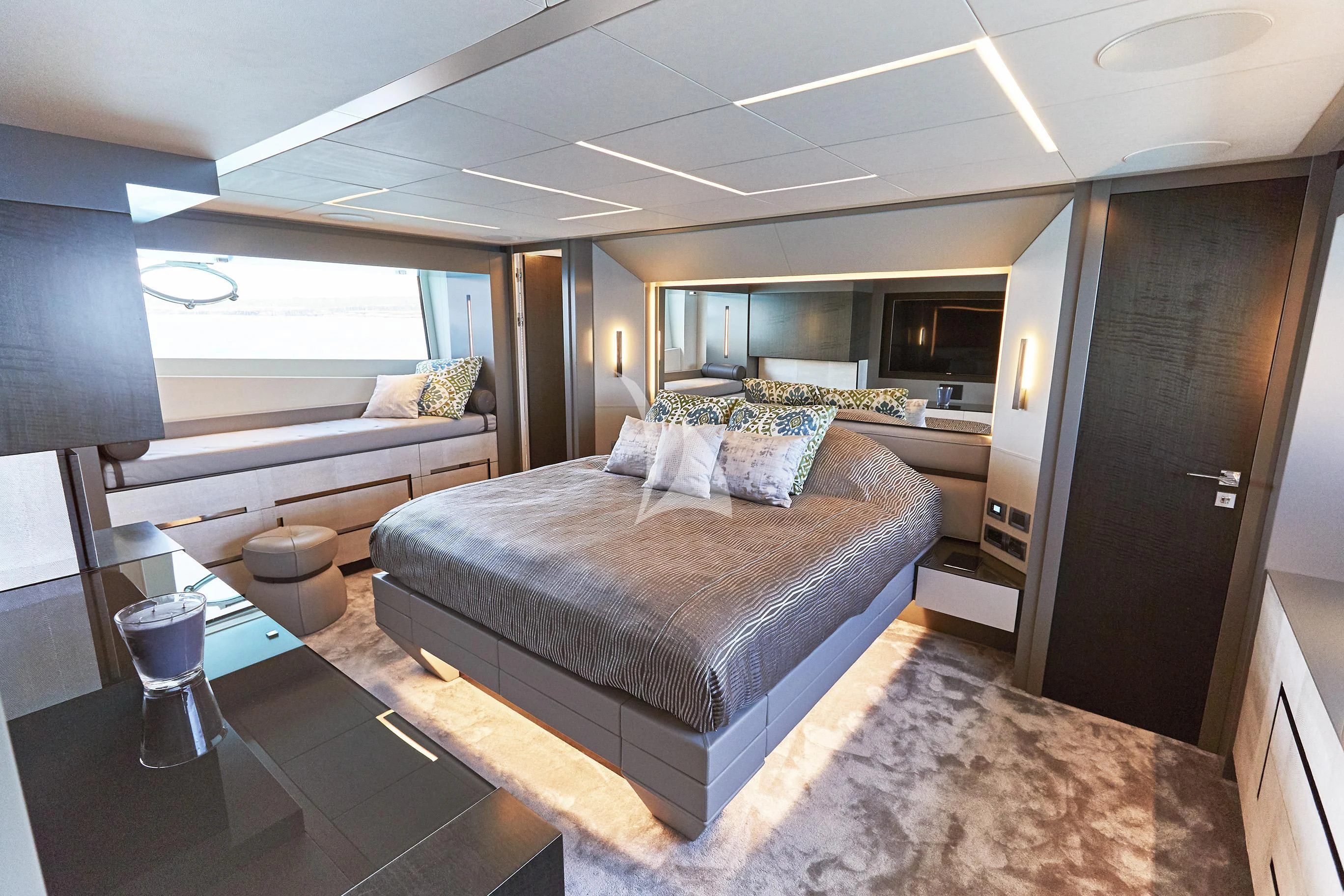 a large bedroom with a large bed aboard BALOO III Yacht for Sale