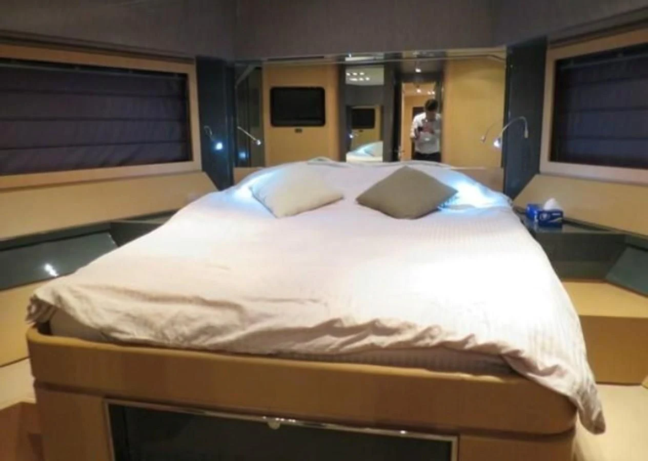 a bed in a room aboard RIVA 86 DOMINO Yacht for Sale
